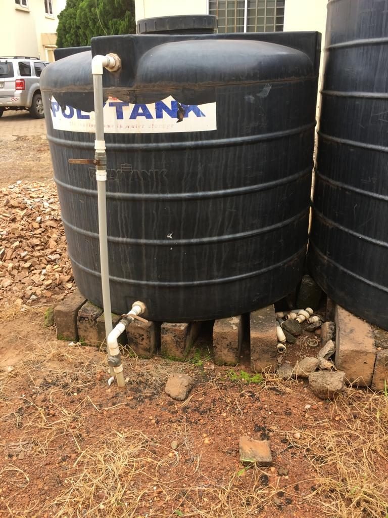 Badly placed water storage tank on bricks