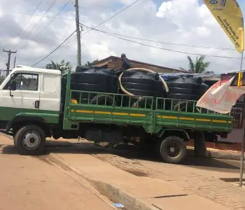 green water tanker truck carrying Polytanks