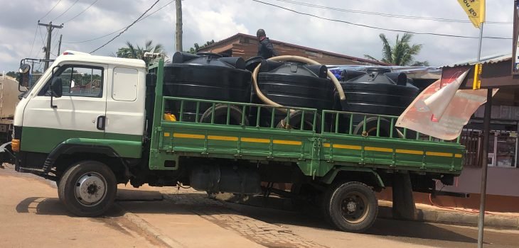 green water tanker truck carrying Polytanks