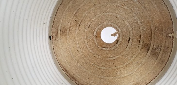 dirty brown colour at bottom of Polytank